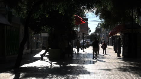 Chile-Calama-man-on-phone-on-shaded-mall-2