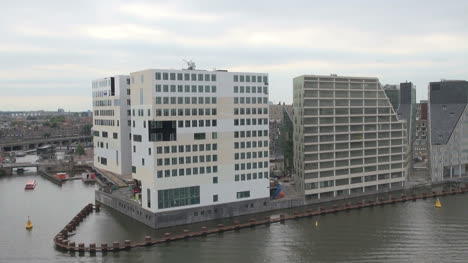 Amsterdam-passing-white-buildings