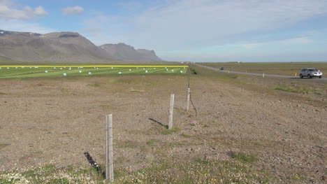 Iceland-west-farm-and-road-with-cars