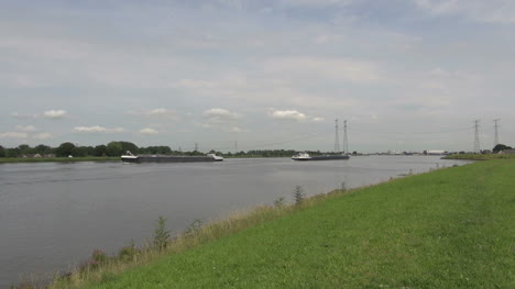 Netherlands-two-barges-move-apart-on-canal-1