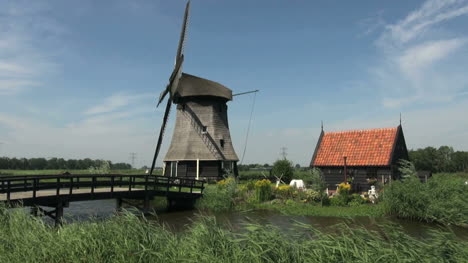 Netherlands-Kinderdijk-bridge-leading-to-windmill-and-small-windmill-19