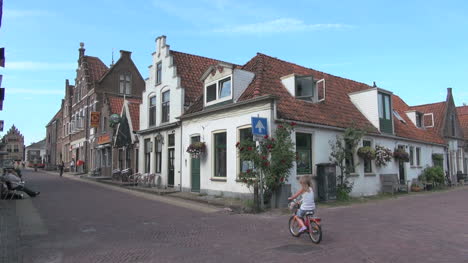 Netherlands-Edam-family-strolls-by-gable-facade