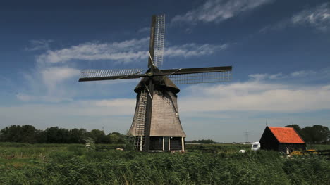 Netherlands-Kinderdijk-clouds-pass-behind-windmill-blades