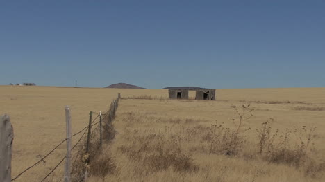 New-Mexico-fence-and-shack-on-plain-1