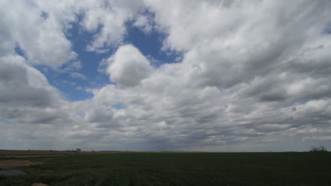 Slow-time-lapse-of-moving-clouds-over-plains