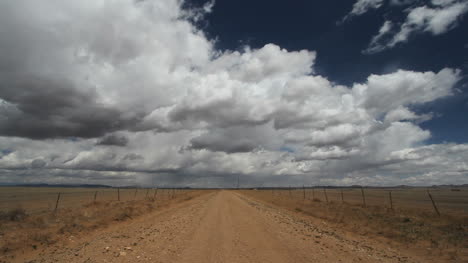 Clouds-move-rapidly-over-a-lonely-road