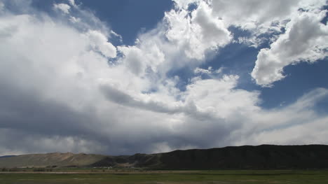 Dramatic-clouds-move-across-low-hills