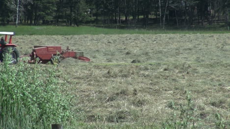 British-Columbia-Agate-Bay-Rd-tractor-baling-hay