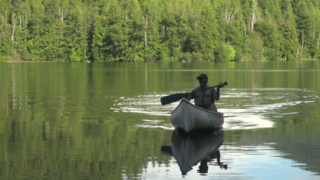 British-Columbia-Echo-Lake-man-approaches-in-canoe
