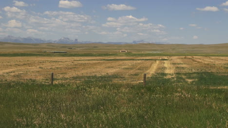 Montana-ranch-land-with-distant-mountains-s