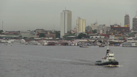 Manaus-Amazon-River-with-tug-boats-and-skyline