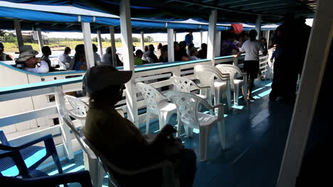 Brazil-Amazon-backwater-near-Santarem-people-on-boat,-c