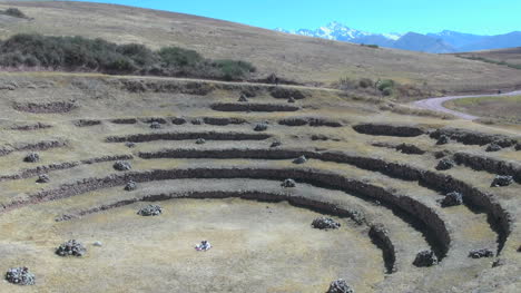 Peru-Moray-agricultural-terraces-and-road-with-motor-bike-s