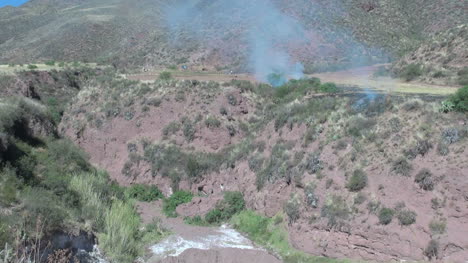 Peru-Sacred-Valley-blue-smoke-drifts-over-a-ravine-12