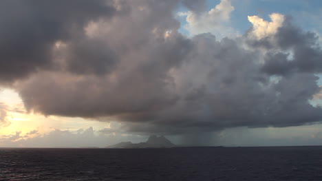 Bora-Bora-with-rain-shower-seen-from-sea