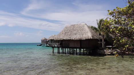 Bora-Bora-a-thatched-cottage-stands-on-the-edge-of-the-lagoon