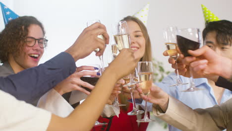 Happy-Multiethnic-Colleagues-Toasting-With-Champagne-And-Wine-And-Drinking-At-The-Office-Party-3