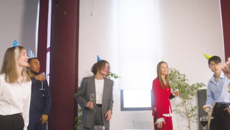 Group-Of-Multiethnic-Colleagues-Dancing-And-Having-Fun-Together-At-The-Office-Party-1