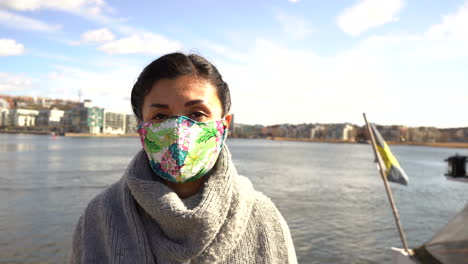 Portrait-of-asian-woman-wearing-protective-safety-mask-against-coronavirus