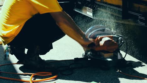 Carpenter-is-cutting-a-piece-of-wood-using-an-electrical-saw