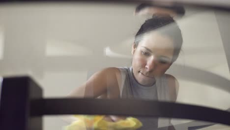 Young-Latina-woman-desinfecting-and-cleaning-surfaces-at-home-during-the-Quarantine