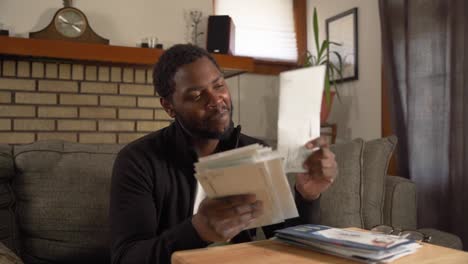 Black-man-receiving-important-mail-excited-close-up