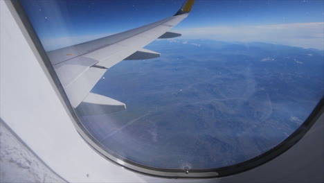 POV-Window-Airplane-View-and-Closing-window-for-transition,-above-the-Alps