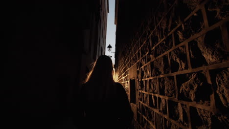 Follow-Cam-from-a-girl-walking-through-narrow-streets-of-Barcelona-in-Spain