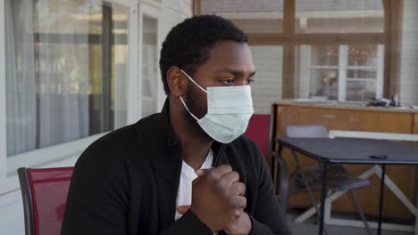 Coronavirus-mask-outside-black-man-panning-shot