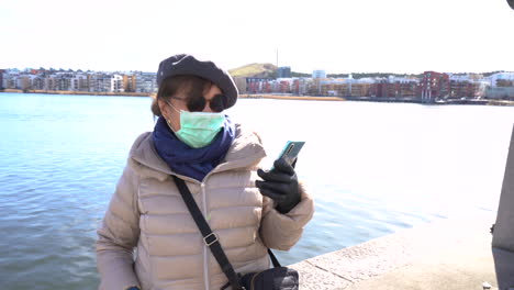 Woman-is-wearing-safety-protective-mask-and-gloves-against-coronavirus-emergency