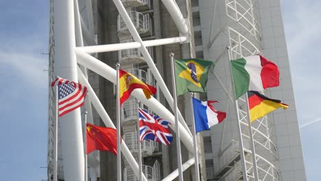 International-flags-flying-in-front-of-Vasco-da-Gama-tower-in-Lisbon-Portugal