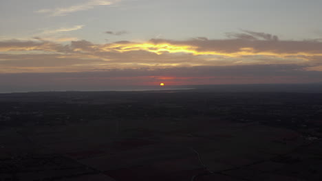 Sun-is-setting-on-the-horizon-of-Mallorca,-Spain