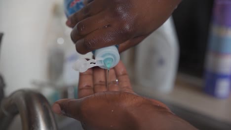 Black-man-uses-soap-wash-hands-Coronavirus-close-up