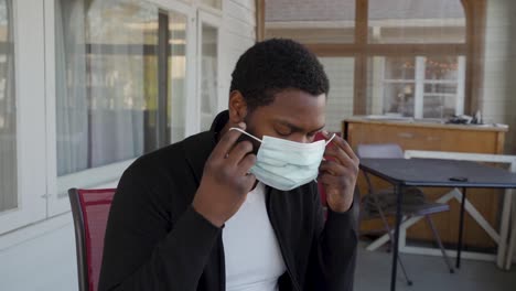 Coronavirus-mask-outside-worried-black-man-panning-shot