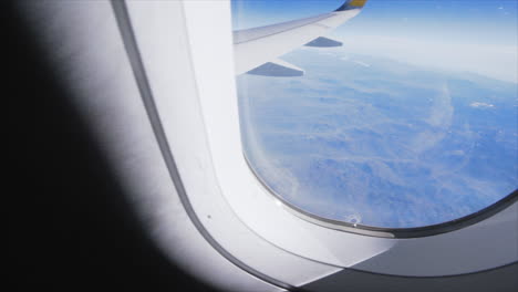 POV-Window-Airplane-View-and-Closing-window-for-transition,-Above-the-Alps-1