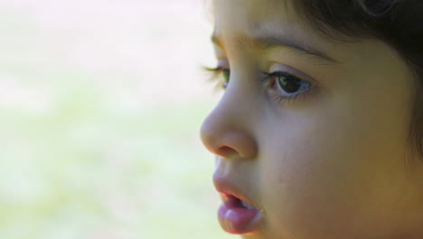 Close-up-shot-of-young-brown-eyed-girl-looking-and-talking