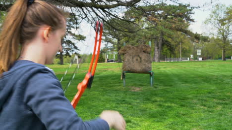 Archery:-HD-footage-of-girl-shooting-a-bow-and-arrow-at-an-archery-range-1