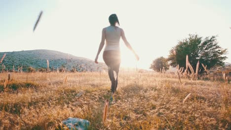 Girl-walking-through-a-wild-wheat-field