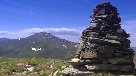 Mountain-top-and-pile-of-stones-nearby