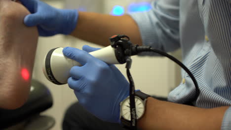 Woman-getting-a-laser-treatment-for-her-feet-in-a-paediatric-clinic-1