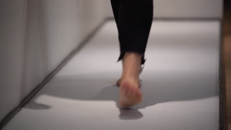 Woman-walking-barefoot-in-a-paediatric-clinic-1