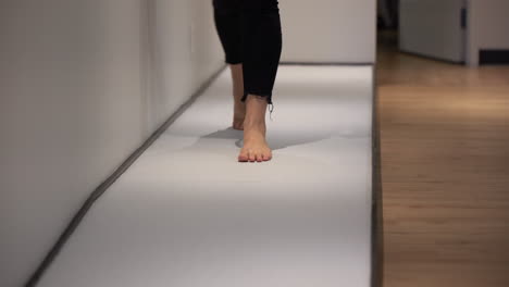 Woman-walking-barefoot-in-a-paediatric-clinic