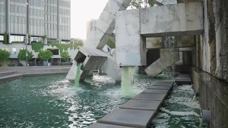 Green-water-fountain-in-downtown,-120fps
