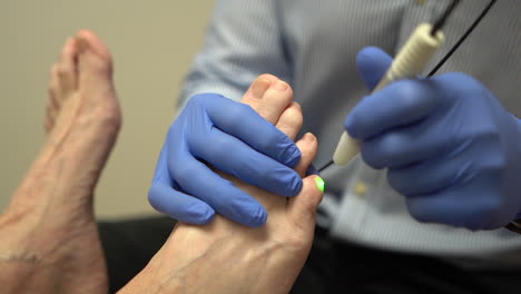 Woman-getting-a-laser-treatment-for-her-feet-in-a-paediatric-clinic-2