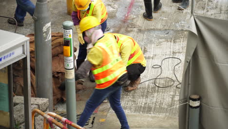 Red-marking-on-a-concrete-surface-are-cut-with-a-stone-saw