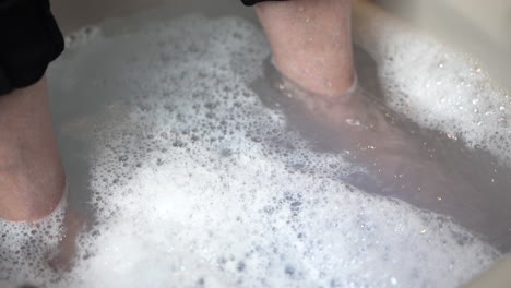 Filling-up-a-foot-bath-with-water-and-bubbles-in-a-paediatric-clinic-1