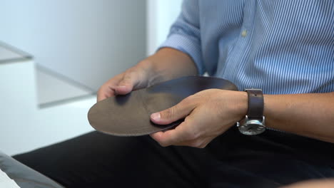 Paediatrician-testing-flexibility-of-orthotics-in-a-paediatric-clinic