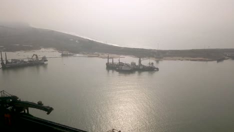 Mist-Covering-Massive-Port-Harbor-Of-Paradip-in-Orisha,-India---aerial-shot