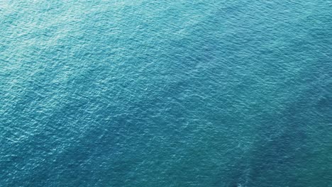 Aerial-Drone-View-of-Calming-Peaceful-Ocean-Seascape-Background-of-Sea-with-Copy-Space,-Turquoise-Water-Colour-in-Tropical-Island-Paradise