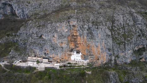 Aerial-drone-view-of-Ostrog-monastery-in-vertical-rocky-mountain-is-the-most-popular-pilgrimage-place-in-Montenegro-4